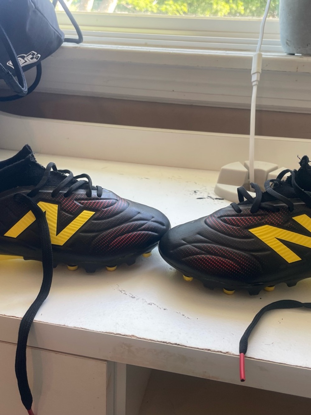 New Balance Kids Black & Yellow Soccer Cleats with Red Accents